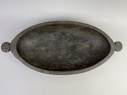 Food dish decorated with a rim incised with...