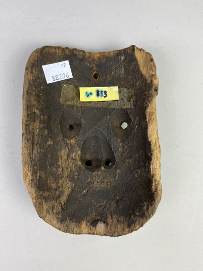 Mask with human face. Wood with light brown...