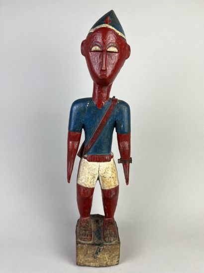 Colon statuette depicting a standing man...