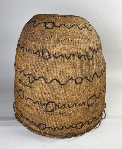 A large, ancient woven basket worn by shamans...