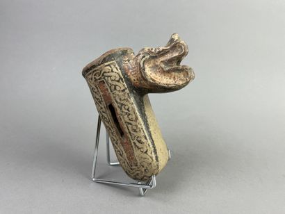 Two superb feet from a tripod bowl depicting...