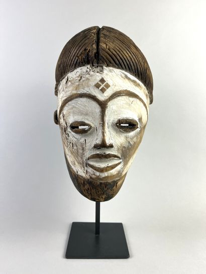 Okuyi facial mask, portrait of a young girl....