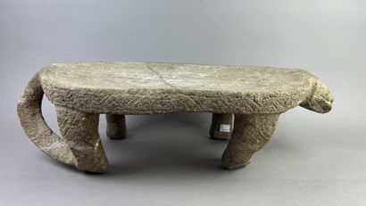 Metate. Corn grinding table in the shape...