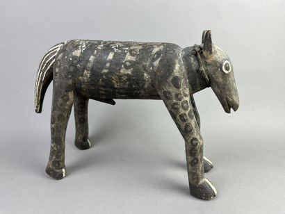 Sculpture of a horse resting on its four...