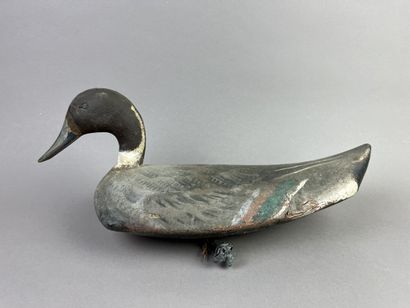 Antique wooden duck caller. Presence of its...