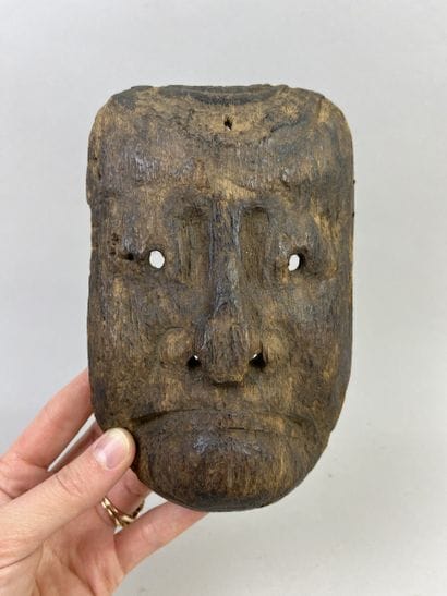 Mask with human face. Wood with light brown...