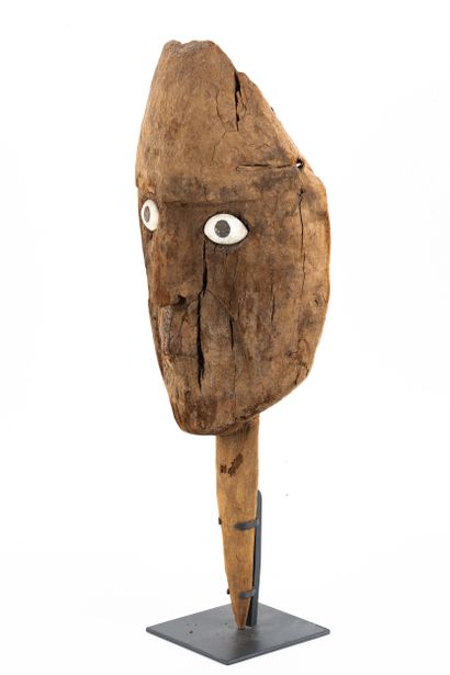 Funerary bundle mask. The face has a rather...