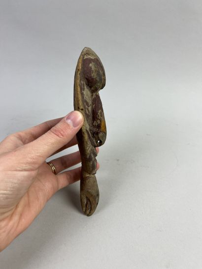 Small amulet head representing an ancestor's...