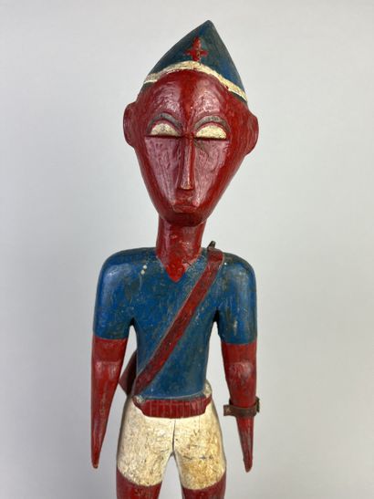 Colon statuette depicting a standing man...