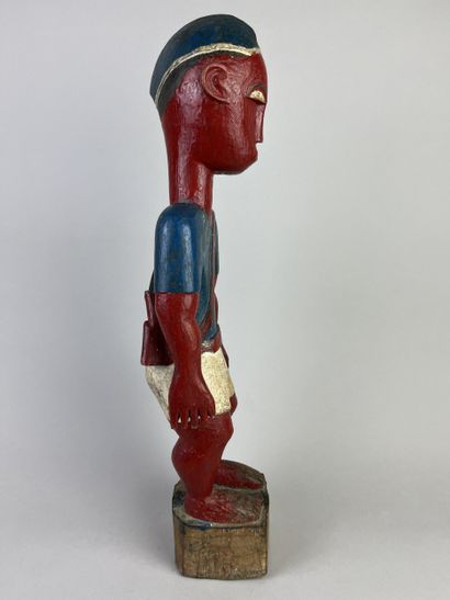 Colon statuette depicting a standing man...