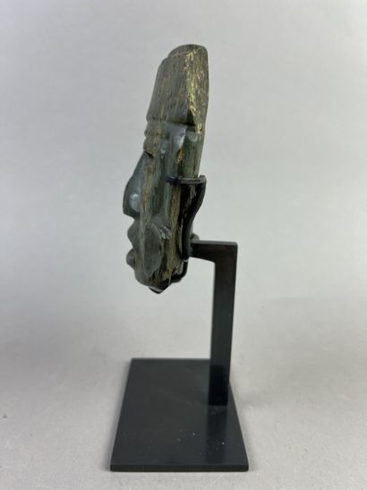 Human head from a large statue. The features...