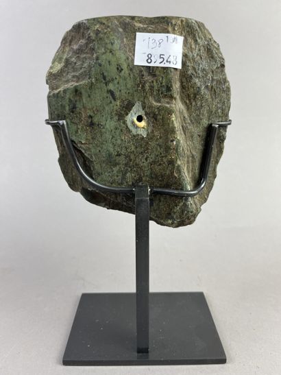 Human head from a large statue. The features...