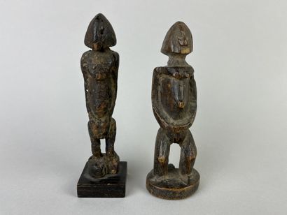 Two antique cubist-style small fetishes shown...