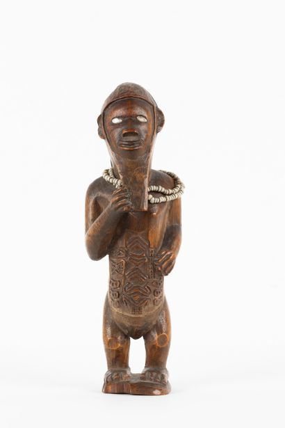 Mukuya ancestor. Male statuette, shown standing...