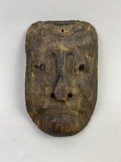 Mask with human face. Wood with light brown...