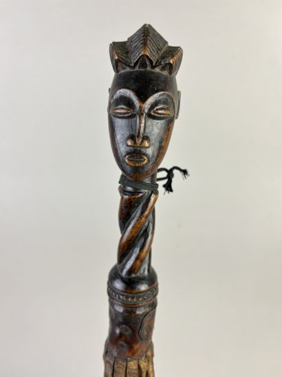 Flycatcher. The handle depicts a human head...
