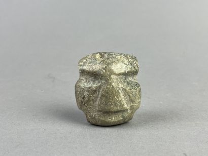 Pendant mask. The face is rectangular. Biconical...