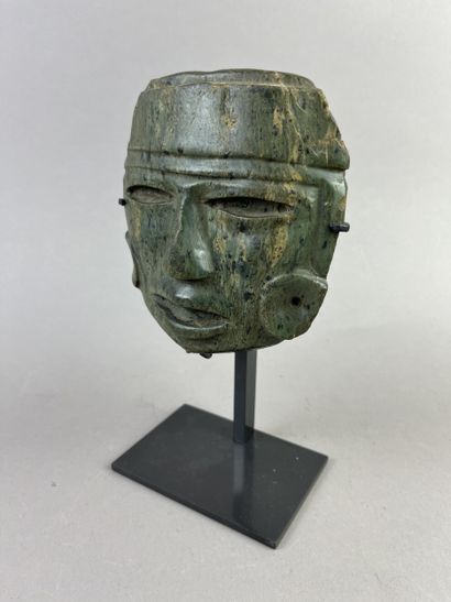 Human head from a large statue. The features...