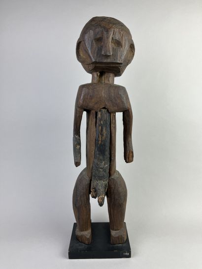 Male statue depicted standing with arms at...