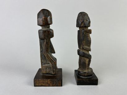 Two antique cubist-style small fetishes shown...
