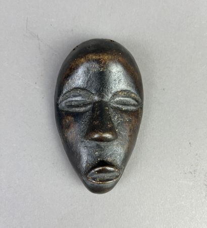 Passport mask. This miniature mask reproduces...