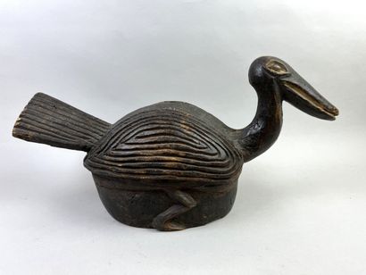 Helmet mask. This headdress depicts a bird,...
