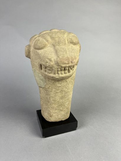 Feline head from an anthropo-zoomorphic deity....