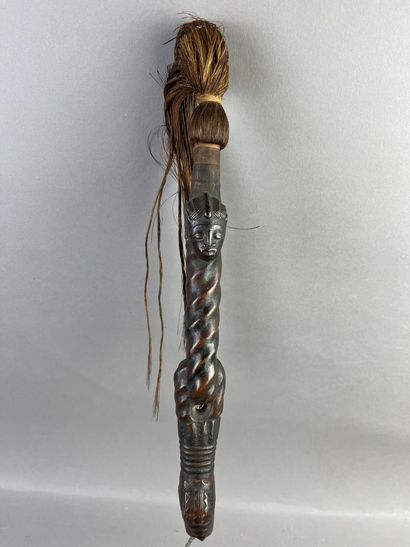 Fly swatter. The twisted handle is decorated...