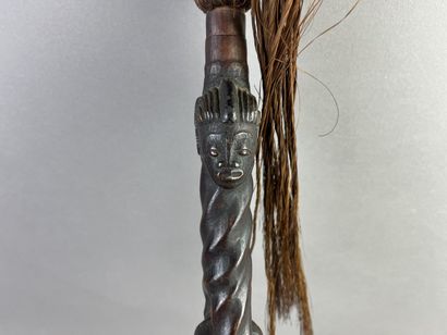 Fly swatter. The twisted handle is decorated...