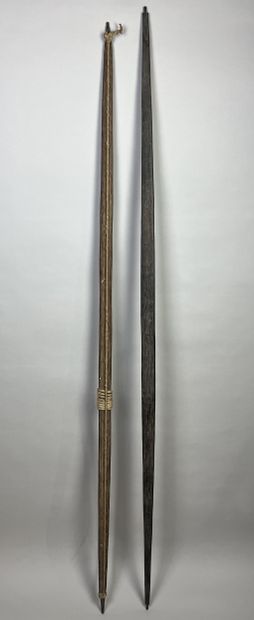 Two bows: A palm wood bow with a light cotton...