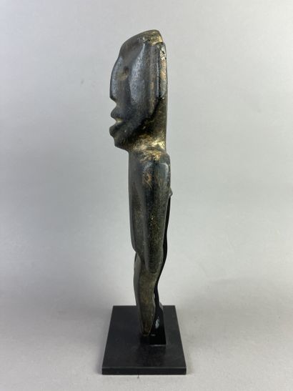 Anthropomorphic idol. Standing figure, arms...