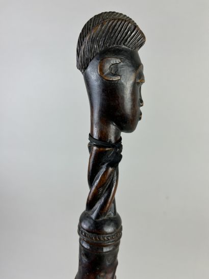 Flycatcher. The handle depicts a human head...