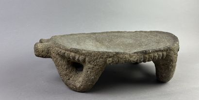 Metate. Corn grinding table. The top is supported...