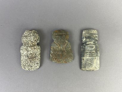 Three pendants depicting stylized figures....