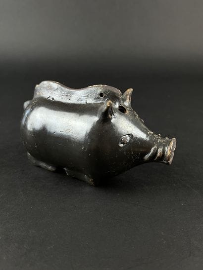 Plastic vase in the shape of a boar. Black...
