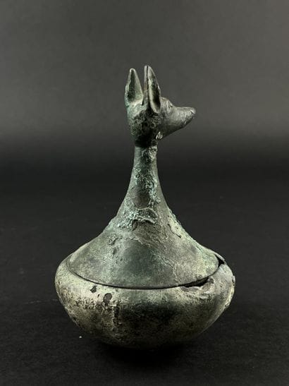 Vase with a zoomorphic head on the lid. Bronze....