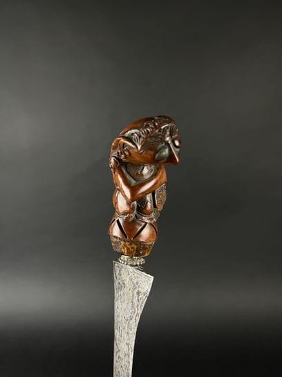 Kriss, the damascened blade depicts the snake...