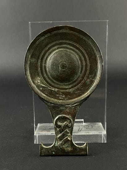 Circular mirror with twisted handle. Bronze,...