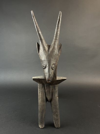 Tripod seat representing an antelope. Wood...