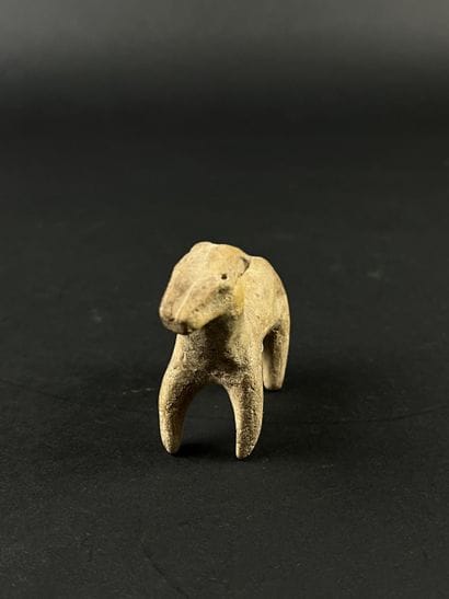 Statuette representing a stylized horse....