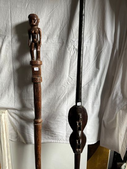 Two canes each representing a figure, one...