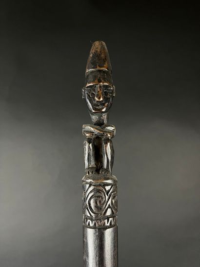 Command baton depicting a kneeling figure...