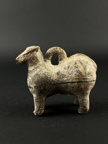Lot consisting of a zoomorphic askos, a ram-head...