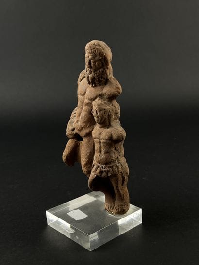 Statuette representing a bearded figure and...