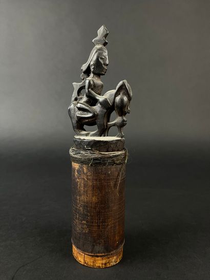 Bamboo box with wooden stopper representing...