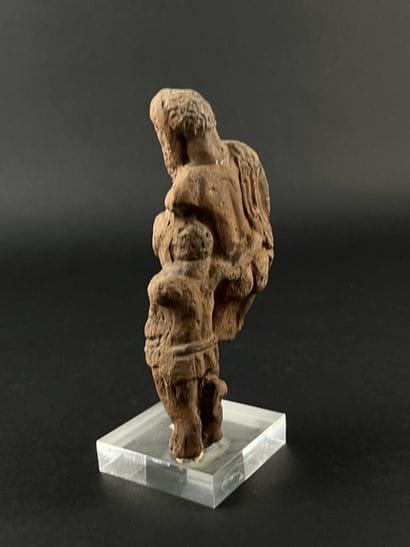 Statuette representing a bearded figure and...