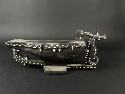 Blackened wood bowl representing a frigate...