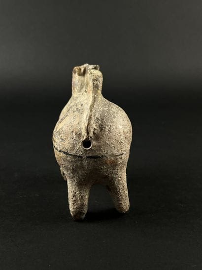 Lot consisting of a zoomorphic askos, a ram-head...