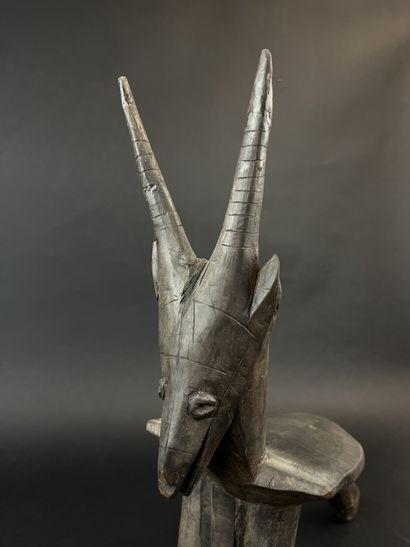 Tripod seat representing an antelope. Wood...