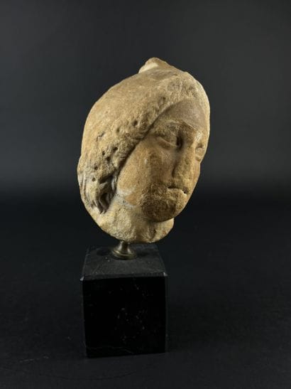 Head representing the helmeted goddess Minerva....